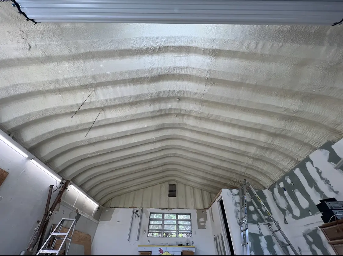 Spray polyurethane foam applied to the underside of a metal roof deck in Westwood
